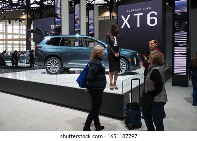 CHICAGO, ILLINOIS - February 8, 2020: Young Female Representative Interacting With Visitors At The New 2020 Cadillac XT6 Display At McCormick Place At The Annual Chicago Auto Show 