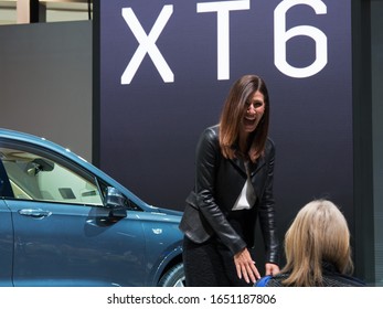 CHICAGO, ILLINOIS - February 8, 2020: Young Female Representative Advertising The New 2020 Cadillac XT6 Displayed At McCormick Place At The Annual Chicago Auto Show 