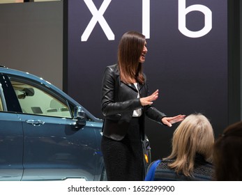 CHICAGO, ILLINOIS - February 8, 2020: Young Female Representative Advertising The New 2020 Cadillac XT6 Displayed At McCormick Place At The Annual Chicago Auto Show 