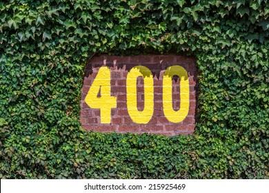 CHICAGO, ILLINOIS - SEPTEMBER 8: 400 Feet Sign On The Outfield Wall Of Wrigley Field On September 8, 2014 In Chicago, Illinois