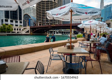 Chicago, Illinois, USA - Aug 16, 2019: Cafe Tables Along The Chicago River