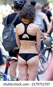 Chicago, Illinois, USA July 6, 2020
Black Lives Matter Protest At The Federal Building In Downtown Chicago. Female In Bikini With Names Of People Injured Or Killed As A Result Of Police Brutality.