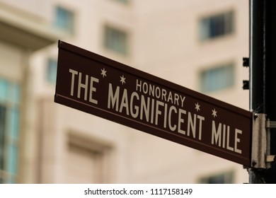 CHICAGO, ILLINOIS, USA - JUNE 14, 2018: Chicago's Magnificent Mile Street Sign Along Michigan Avenue. The Area Is The City's Premier Shopping Destination.