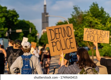 Chicago, Illinois / USA - June 4 2020: Peaceful Protest Sign 'defund the police' and 'abolish police' in Downtown Chicago, West Loop Neighborhood over George Floyd Death.