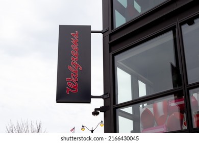 Chicago, Illinois, USA - March 29, 2022: A Walgreen projecting sign on the building is shown. Walgreen Company is an American company that operates a pharmacy store chain. 