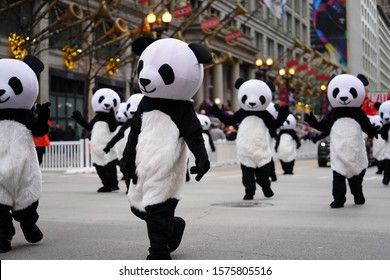 Chicago, Illinois / USA - November 28th 2019: Members of the Wu Zhi Lin  Performing arts dressed up in Panda suit costumes and part take in 2019 Uncle Dan's Chicago Thanksgiving Parade.