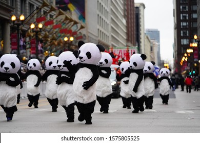 Chicago, Illinois / USA - November 28th 2019: Members of the Wu Zhi Lin  Performing arts dressed up in Panda suit costumes and part take in 2019 Uncle Dan's Chicago Thanksgiving Parade.