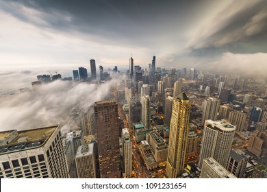 Chicago, Illinois, USA skyline from above with storm clouds and fog rolling in. - Powered by Shutterstock