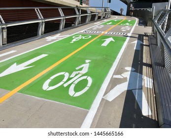CHICAGO, ILLINOIS/JULY 8, 2019: Divided bicycle and pedestrian trail is marked for wayfinding travel over newly opened flyover bridge project at Navy Pier 