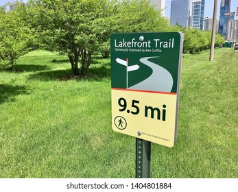 CHICAGO, ILLINOIS/MAY 22, 2019: Wayfinding sign 9.5 mile Lakefront Trail, Chicago Park District, generously improved by Hedge Fund investor Ken Griffin at Lakefront Lake Michigan