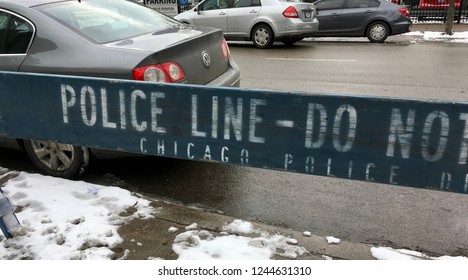 CHICAGO, ILLINOIS/NOVEMBER 29, 2018: Chicago Police Line Barricade Blocks Access To Snow Covered Sidewalks At Near North Side By Brazilian Steakhouse In River North