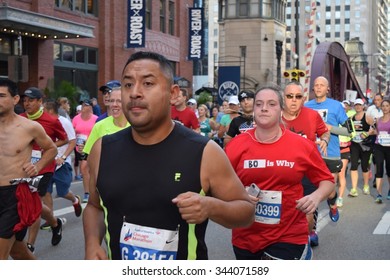 CHICAGO, ILLINOIS/USA â??OCTOBER 11, 2015: Chicago Bank Of America Marathon Hispanic Runner On October 11, 2015 In Chicago Near North Loop. 