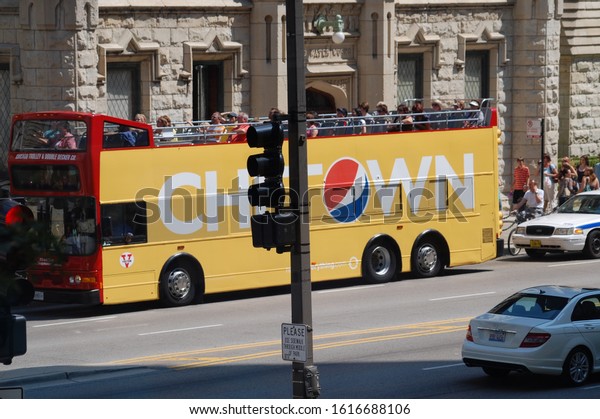 Chicago,\
Illinois/USA -August 14, 2009 -  A colorful yellow and red tourist\
bus going down Michigan Ave. with Chi-Town logo on the side of the\
bus with the Pepsi logo in the letter\
\