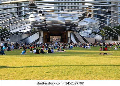 CHICAGO, IL/USA - JULY 8, 2019: Another Free Outdoor Concert At The Pritzker Amphitheater In Millennium Park In Downtown Chicago.  Friends And Family Enjoy The Music And Picnic On The Lawn.