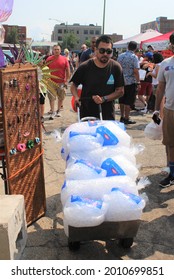 CHICAGO - JULY 2021: Man Brings More Ice To Latino Street Fair Or Food Festival In Pilsen Neighborhood In July 2021 In Chicago. The Festival Celebrates Latino Food And Heritage.