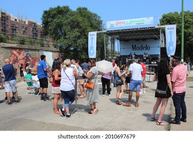 CHICAGO - JULY 2021: People See A Local Band Perform At A Latino Or Hispanic Street Food Festival In The Pilsen Neighborhood In July 2021 In Chicago. The Festival Celebrates Latino Food And Heritage.