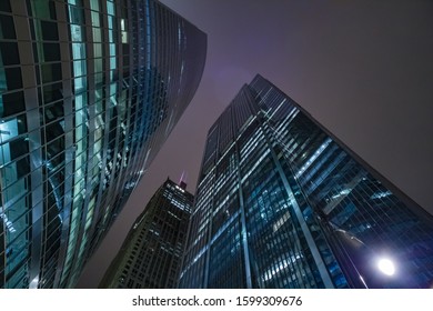 Chicago Night Life. Chicago Illuminated Skyline View At Dusk, United States.  Bottom Up View