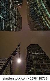 Chicago Night Life. Let There Be Light. Street Lamp And Chicago Illuminated Skyscapers View At Dusk, United States