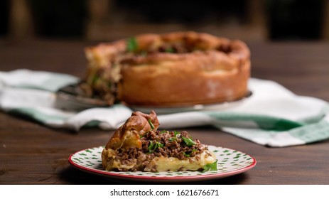 Chicago Pizza Slice On Wooden Table