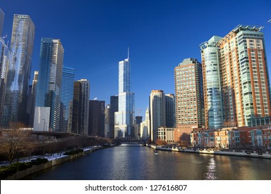 Chicago River with urban skyscrapers and riverwalk, IL, USA