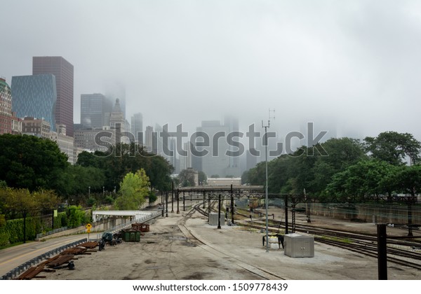 Chicago skyline in the\
fog.