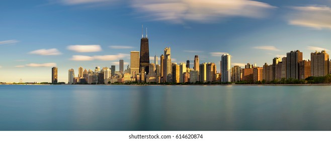 Chicago Skyline Panorama Across Lake Michigan At Sunset Viewed From North Avenue Beach. Long Exposure.