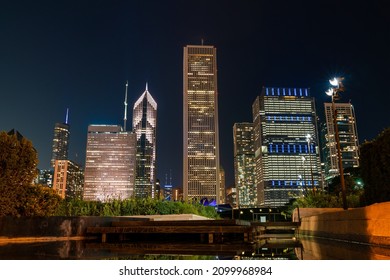 Chicago Skyline Panorama From Park At Night Time. Chicago, Illinois, USA. Skyscrapers Of Financial District, A Vibrant Business Neighborhood.