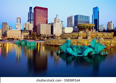 Chicago skyline reflected in Buckingham Fountain. Chicago, Illinois, USA.
