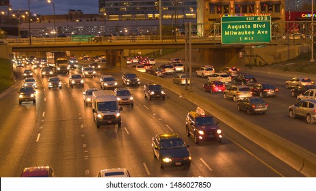 CHICAGO, UNITED STATES - 20 OCTOBER 2016: DEFOCUSED BOKEH Cars, SUVs, Pickup Trucks And Semi-trailer Trucks Caught In Traffic Jam On Busy Multiple Lane Highway. Blurry Car Lights Glowing In The Dark