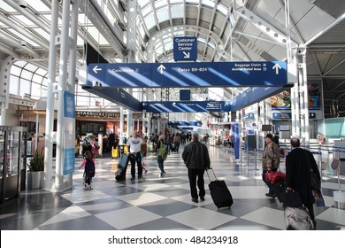 CHICAGO, USA - APRIL 1, 2014: Travelers walk to gates at Chicago O'Hare International Airport in USA. It was the 5th busiest airport in the world with 66,883,271 passengers in 2013.
