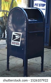 Chicago, USA; June 27, 2019: A US Postal Service Mailbox On The Sidewalk.