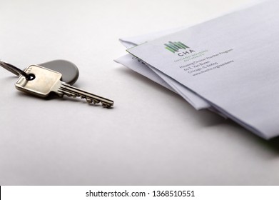 Chicago, USA-April 10, 2019: A Letter Or Mail Piece From Chicago Housing Authority CHA Is Displayed With A Door Key And Key Fob. Public Housing Assistance Program, Housing And Urban Development.