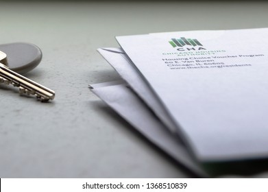 Chicago, USA-April 10, 2019: A Letter Or Mail  From Chicago Housing Authority Is Displayed With An Apartment Door Key And Key Fob. Public Housing Assistance Program, CHA, Housing And Urban Development