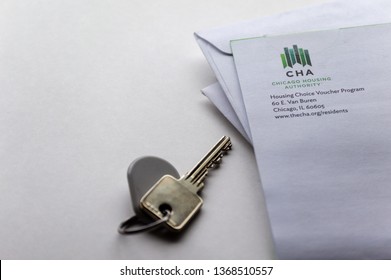 Chicago, USA-April 10, 2019: A Mail Letter From Chicago Housing Authority CHA Is Displayed With A Door Key And Key Fob. Public Housing Assistance Program, HUD.