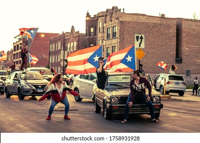 Chicago, USA-June 14, 2020: Girls Twerking On Cars In The Humboldt Park Neighborhood To Express Puerto Rican Pride