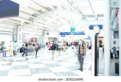 CHICAGO,IL - USA - 08-07-2021: Masked Passengers In The Concourse Of OHare International Airport