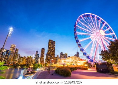 Chicago,illinois,usa. 08-15-17: Beautiful Navy Pier At Night With Chicago Skyline.