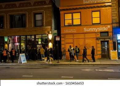 Chicago,IL/USA-January 5th 2020: many customers stand in line at night during cold weather to purchase medical and recreational marijuana from the local dispensary now that's legal on state level.