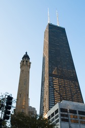 Chicago's Old Water Tower In Front Of The John Hancock Center In Portrait Orientation
