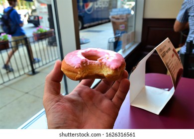 Chicago,USA,8/20/2013,donut With Bite Mark Out Of It In Downtown Chicago Diner.