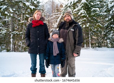 Chic-Chocs, Quebec / Canada - January 6 2017: Caucasian And Weird Family Posing For The Photo In The Woods During The Winter