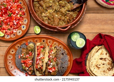 Chicharrones In A Green Sauce Tacos Served With Pico De Gallo Salad. Typical Mexican Food.