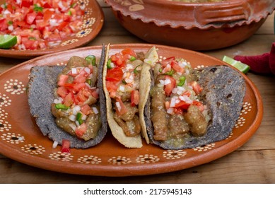 Chicharrones In A Green Sauce Tacos Served With Pico De Gallo Salad. Typical Mexican Food.