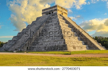 Chichen Itza - Ancient stone pyramid with stepped architecture under a dramatic sky, showcasing historic ruins, cultural heritage, and iconic archaeological design.