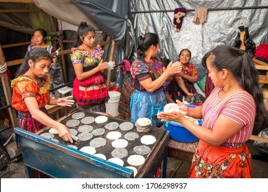chichicastenango, Guatemala, 27th February 2020: mayan ladies at the traditional market making tortillas