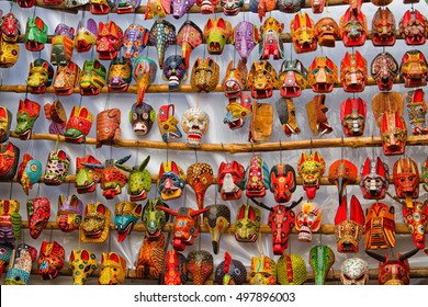 CHICHICASTENANGO , GUATEMALA - APRIL 26, 2014 : Mayan wooden masks for sale at Chichicastenango market in Guatemala. This native market is the most colorful in Central America