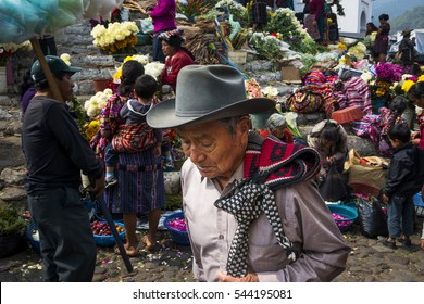 Chichicastenango, Guatemala - April 27, 2014: Local people in a street market in the town of Chichicastenango, in Guatemala
