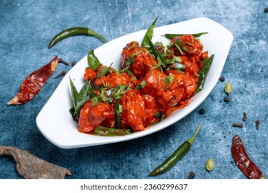 CHICKEN 65 indian style served in white dish - Shutterstock ID 2360299637