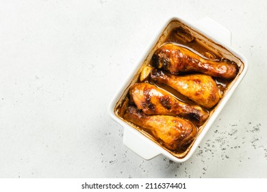 Chicken adobo, drumsticks in baking dish. Top view, copy space.