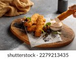 Chicken Alfrado Sticks with mayo dip served in dish isolated on table top view of arabic breakfast